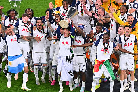 Tottenham's Heung-Min Son raises the trophy of the Europa League after the final soccer match between Tottenham Hotspur and Manchester United at the San MamĂŠs Stadium in Bilbao, Spain, Wednesday, May 21, 2025.