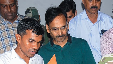 Jharkhand IAS officer Vinay Kumar Choubey (C) after being produced at a special court following his arrest by the Anti-Corruption Bureau (ACB) in a money laundering case linked to the alleged excise scam in the state, in Ranchi, Tuesday, May 20, 2025.