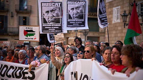 Protesters gather and shout slogans during a demonstration in support of the Palestinian people in Gaza, in Barcelona, Spain, Monday, May 19, 2025.