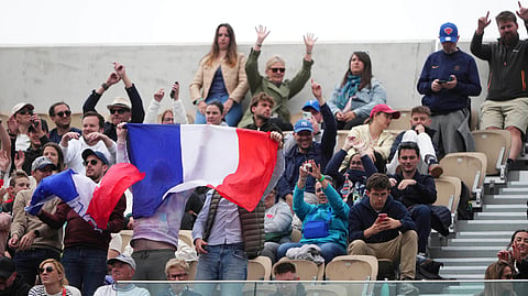 Fans cheer during the first round match of the French Tennis Open between France's Arthur Fils and Chile's Nicolas Jarry, at the Roland-Garros stadium, in Paris, Monday, May 26, 2025.
