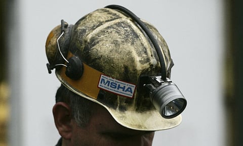 A miner gathers his thought before taking part in a rescue mission, Tuesday, Jan 3, 2006, in Tallmansville, W.Va..