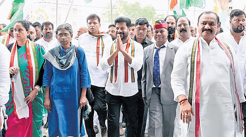 Chief Minister A Revanth Reddy greets people as he takes part in the Jai Hind Yatra at Nizampet, Hyderabad on Thursday.