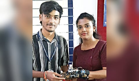 Karan D (left) with his invention Intelligent Geofence-enabled Wearable System, in Mysuru
