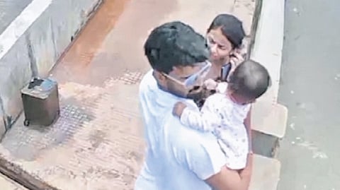 CCTV grab of the couple with their baby on the Gangavali bridge near Gokarna