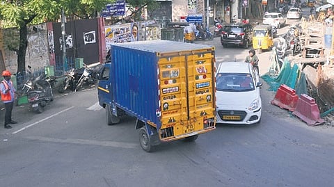 Two-wheelers, autos and other vehicles, parked on the sides of the road, add to congestion by further reducing the motorable area.