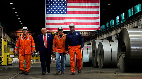 President Donald Trump walks with workers as he tours U.S. Steel Corporation's Mon Valley Works-Irvin plant, Friday, May 30, 2025, in West Mifflin, Pa.