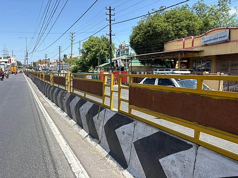 Center median system installed in Kumar Nagar area on Avinashi Road to prevent pedestrians from jumping over it.