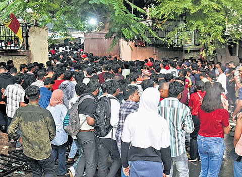 People gather outside M Chinnaswamy Stadium ahead of the victory celebrations of Royal Challengers Bengaluru, in Bengaluru on Wednesday