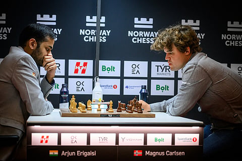 Magnus Carlsen (R) in action against Arjun Erigaisi in Round 10 on Friday