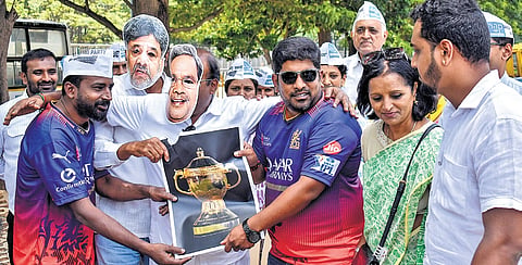 Aam Aadmi Party members stage a protest condemning the Karnataka government over the Chinnaswamy Stadium stampede, which claimed 11 lives, in Bengaluru on Saturday