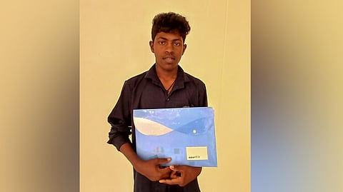 S.Bharath a tribal student from Pachamalai Hills, confirms his B.Com.LLB seat at the at help desk set up in Thuvakudi Government Model Higher Secondary School near Tiruchy on Friday