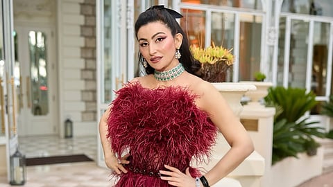 In deep maroon Amit GT gown at The Hollywood Reporter dinner