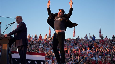 In this photo from October 5, 2024, Elon Musk jumps on the stage as then-Republican presidential nominee Donald Trump speaks at a campaign rally, in Butler, Pennsylvania.