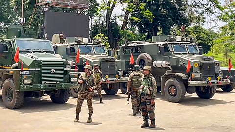 Security personnel keep vigil after the administration imposed prohibitory orders and suspending internet services in five Imphal valley districts following violent protests in Manipur over the arrest of a leader of Meitei outfit Arambai Tenggol, in Imphal, Sunday, June 8, 2025.