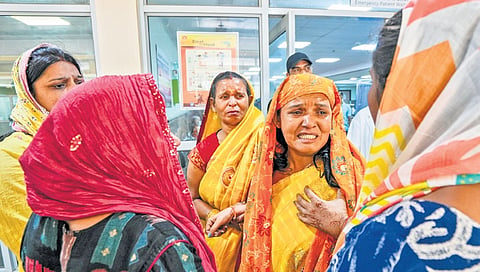 Family members mourn as three people, including two children, die in Dwarka fire incident, in New Delhi on Tuesday