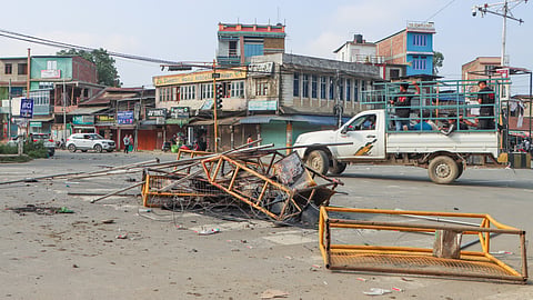 Charred remains of police barricades are seen in the aftermath of overnight violence that erupted in five districts of Imphal Valley, on Sunday, June 8, 2025.