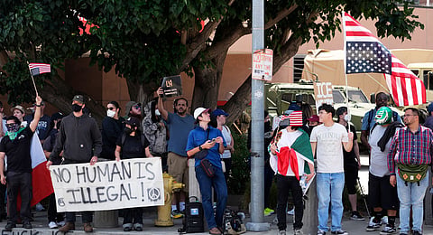 Protesters against federal immigration raids gather outside the Metropolitan Detention Center, Wednesday, June 11, 2025, in Los Angeles.