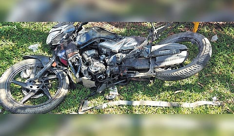 The bike of Ramesh (inset) that was crushed after the girders collapsed on Thursday