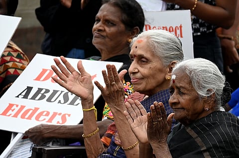 Elders witness a skit during an awareness campaign organised by Bengaluru City Police and Nightingales Medical Trust in Bengaluru
