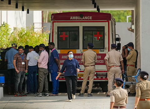 Medics and police personnel outside the mortuary of a hospital, where victims of the Air India plane crash were admitted, in Ahmedabad, Sunday, June 15, 2025. A London-bound Air India plane crashed moments after taking off from the Ahmedabad airport on Thursday, killing 241 people on board, and several others on the ground.