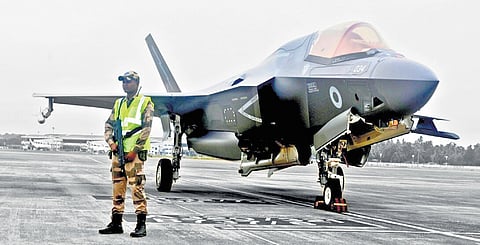 A CISF official guarding the UK F-35 B stealth fighter, grounded at Thiruvananthapuram airport