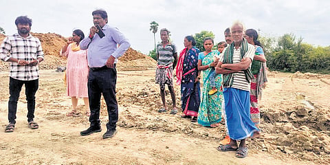 Officials with the rescued bonded workers from Odisha on Tuesday