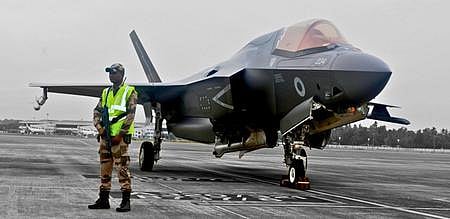 CISF personnel guarding the UK F-35 B stealth fighter, grounded at Thiruvananthapuram International Airport.