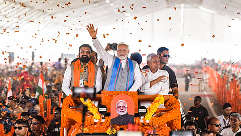 Prime Minister Narendra Modi, Bihar Chief Minister Nitish Kumar and Deputy CM Samrat Choudhary arrive during a public meeting, in Siwan district, Friday, June 20, 2025