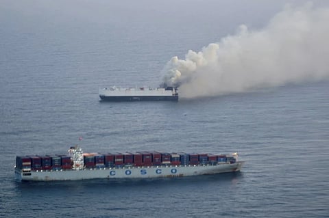 In this photo provided by the U.S. Coast Guard, smoke rises from cargo vessel Morning Midas approximately 300 miles south of Adak, Alaska, June 3, 2025.