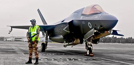 A CISF official guarding the UK F-35 B stealth fighter, grounded at Thiruvananthapuram airport