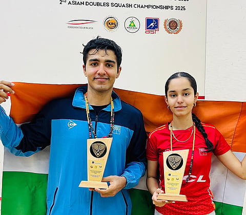 Abhay Singh poses with Anahat Singh after winning the mixed doubles title in the 2nd Asian Doubles Championships on June 26