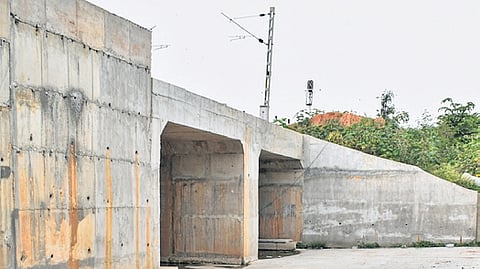 The nearly complete road under bridge in Babusapalya remains inoperational owing to a land dispute.