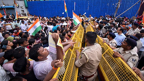 Aspirants of Bihar Public Service Commission (BPSC) Teacher Recruitment Exam (TRE) 4.o being stopped by security personnel during a protest demanding the implementation of a domicile policy in the state government jobs, in Patna, Wednesday, July 2, 2025.