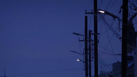 Dim streetlights in Madurai.