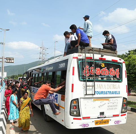 Devotees throng free buses arranged during the Giri Pradakshina at Simhachalam in Visakhapatnam on Wednesday.