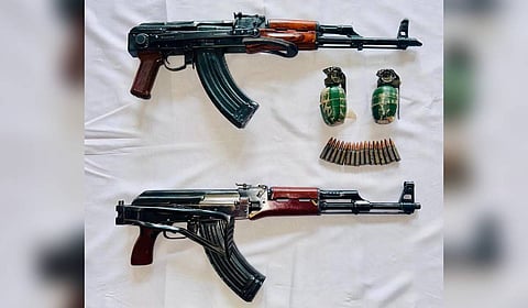 The recovered AK 47 rifles with 16 live catridges and hand grenades.