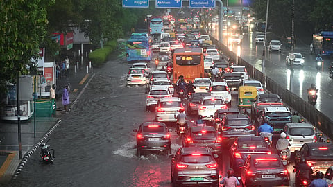 Vehicles ply through Water logged road at ITO after heavy rainfall in New Delhi on Wednesday