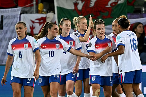 England's forward #11 Lauren Hemp (2nd R) celebrate with teammates after scoring the third goal of the match during the UEFA Women's Euro 2025 Group D football match between England and Wales on July 13, 2025.