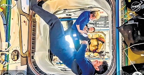In this screengrab from a video posted by NASA on July 14, 2025, astronaut Shubhanshu Shukla with other crew members of the Axiom-4 mission aboard the Dragon Grace spacecraft during their journey back to Earth