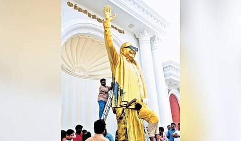 Workers cleaning the statue in Salem
