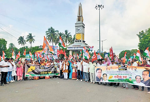 Congress workers staging protest at Balasore town on Thursday