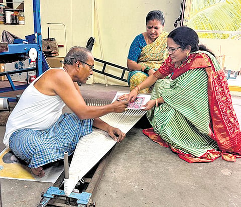 Gajam Narmada gives direction to a weaver