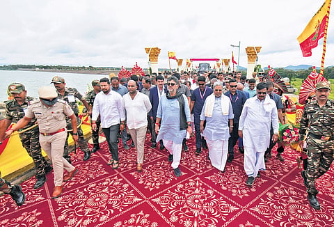 CM Siddaramaiah and DCM DK Shivakumar arrive to offer bagina at the Kabini reservoir in HD Kote taluk, Mysuru district, on Sunday.