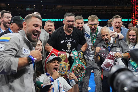 Ukraine's Oleksandr Usyk celebrates winning the undisputed world heavyweight boxing title fight against Britain's Daniel Dubois in London, Saturday, July 19, 2025.