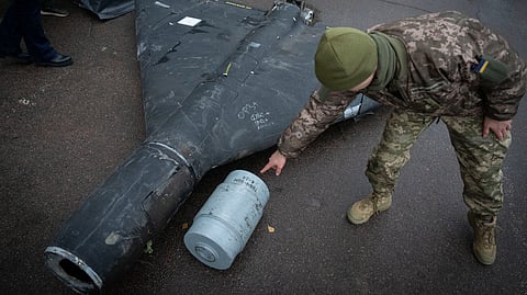 A Ukrainian officer shows a thermobaric charge from a downed Russian drone in a research laboratory in an undisclosed location in Ukraine on, Nov. 14, 2024.
