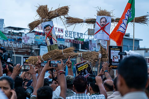 Bharatiya Janata Yuva Morcha take out a demonstration holding effigy of Rahul Gandhi and Bhakta Charan Das after the Youth Congress president arrested in alleged rape case, at Master Canteen Square in Bhubaneswar on Monday.