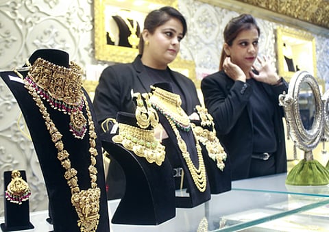 Globally, gold held steady below $4,000 per ounce amid mixed signals from the US Federal Reserve on future interest-rate cuts.