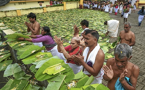 People perform 'Karkidaka Vavu Bali' ritual for their ancestors during the 'Karkidaka' month.