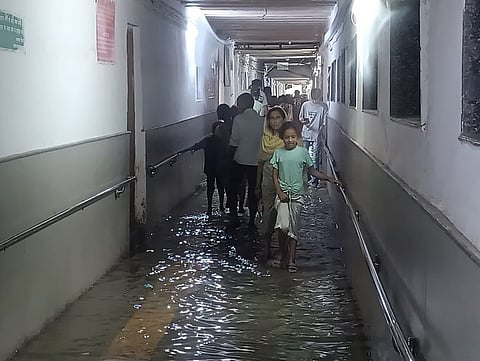 The corridor remained inundated through much of the day, creating difficulties for patients, especially the elderly and those with mobility issues.