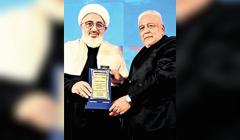 Hussain Day convener Aga Sultan felicitates Dr Abdolmajid Hakimollahi, representative of Iran’s supreme leader, in Bengaluru on Sunday.